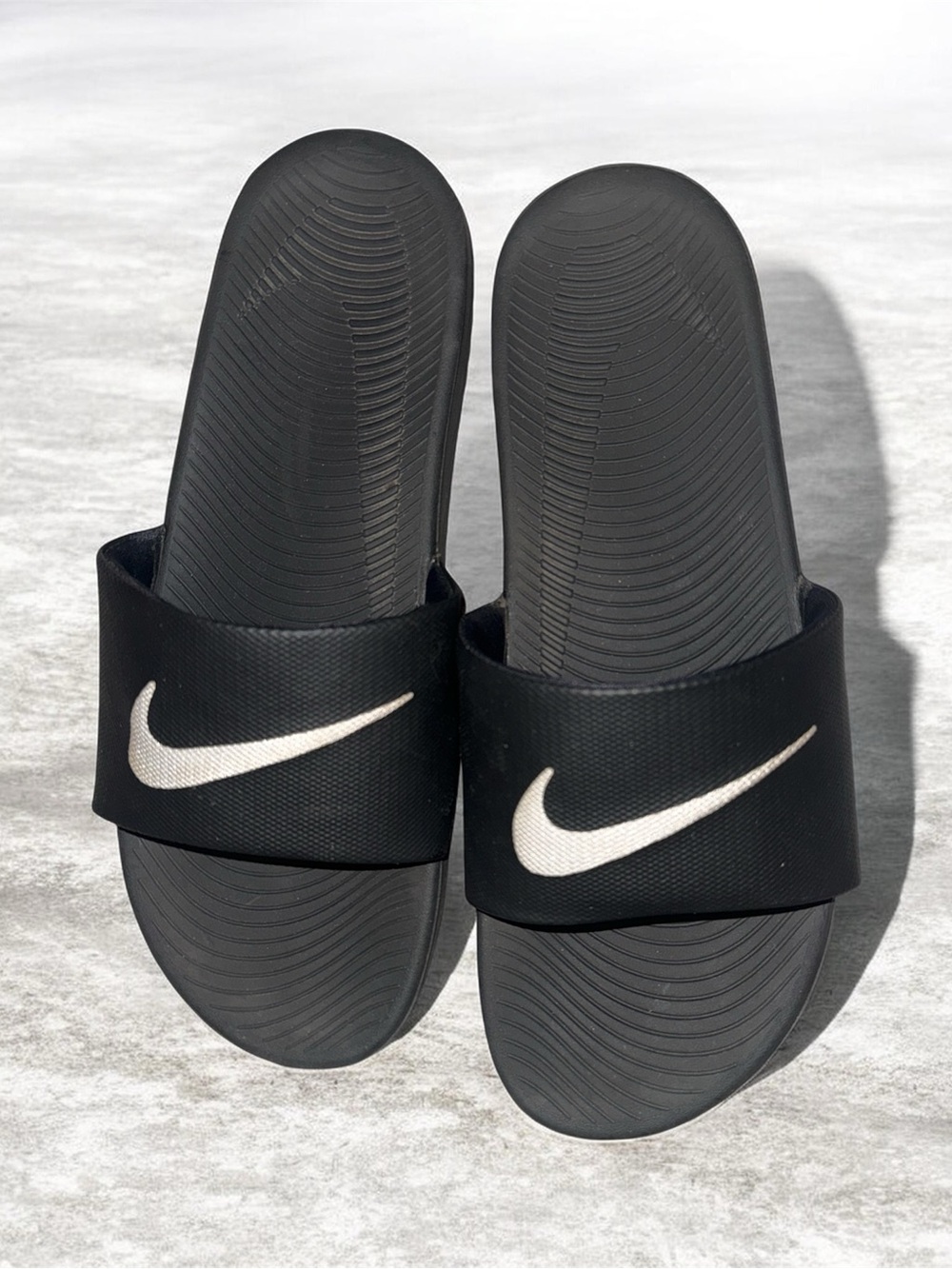 Nike Black Slides with White Swoosh Logo
